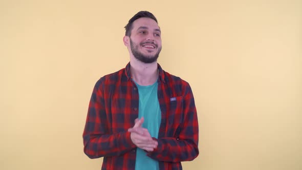 Young Smiling Man Clapping Saying and Moving Head Up and Down alt