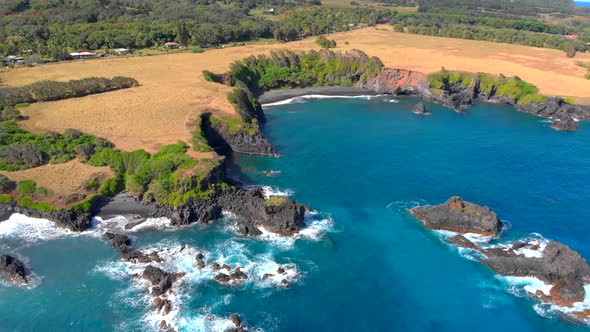 MUST SEE!!! Beautiful epic 4k Drone shot in Maui hidden private beach near to Hana. Black volcanic s alt