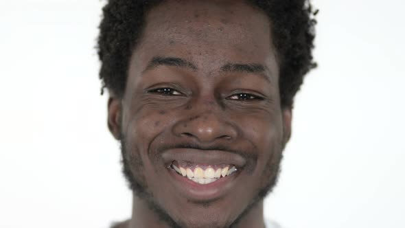 Face Close Up of Smiling African Man, White Background alt