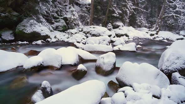 8K River in Snowy Untouched Forest in Winter