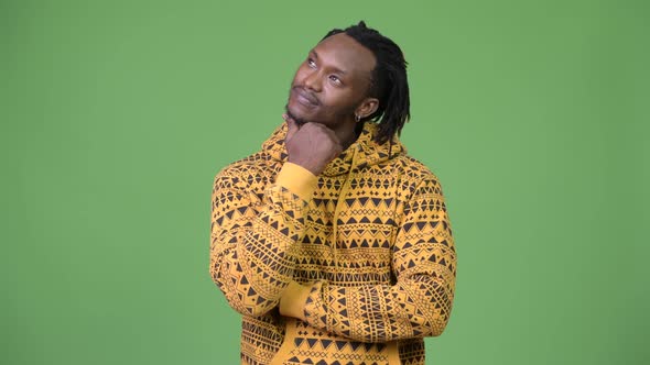 Young Handsome African Man Thinking alt
