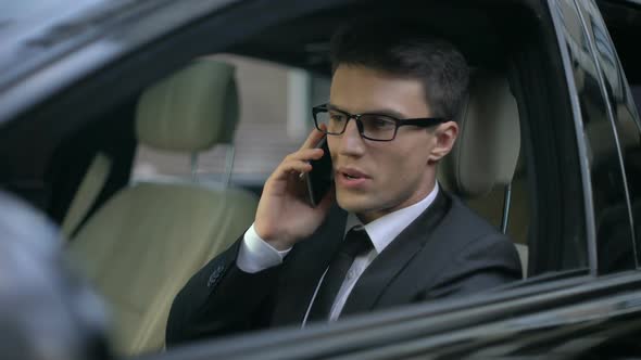 Worried Businessman Talking on Phone, Finding Out About His Bankruptcy, Problems alt