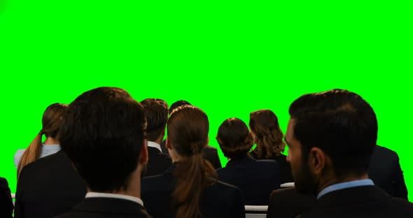 Business executives looking at invisible screen alt