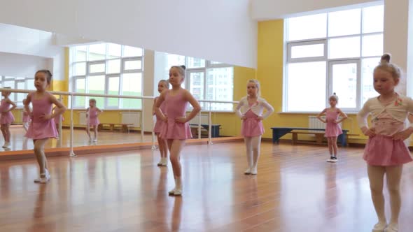 Group of little girls practicing in ballet school