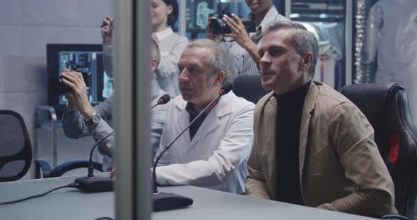 Astronauts Talking with Journalists Before Departure alt