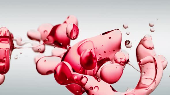Transparent Cosmetic Red Oil Bubbles and Shapes against White Background