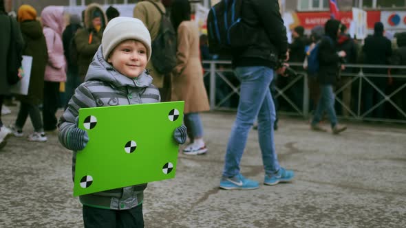 Carefree Kid with Mockup Placard Jumping