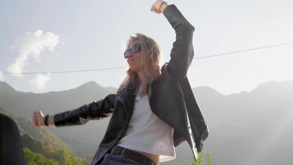 Caucasian Girl Dancing in a Red Convertible Car