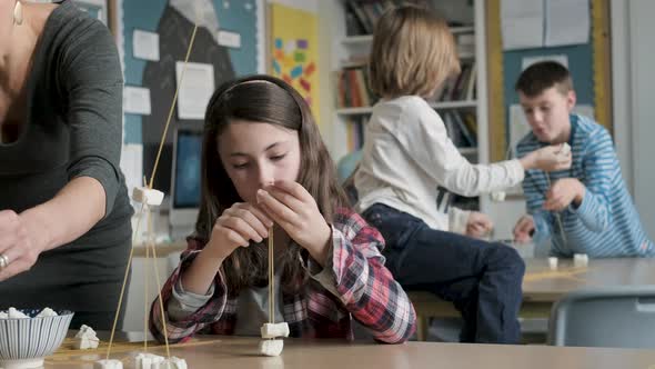 Children setting up construction during a science lesson alt