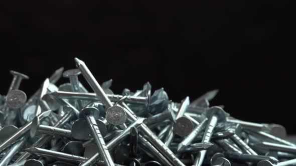 Hobnails are Spinning Close Up Background Metal Steel Nails for Construction Work Rotating on alt