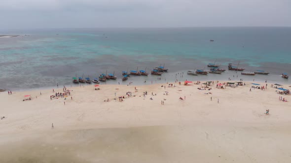 Aerial View Disappearing Island with Tourists and Boats in Menai Bay Zanzibar alt
