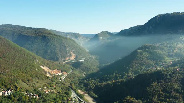 Aerial View of Mountain Ranges in Autumn alt