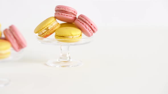 Yellow and Pink Macarons on Glass Stands alt