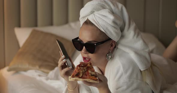 Fashion Woman Smiling Talking Using Smartphone After Shower Lying on Bed Full Shot