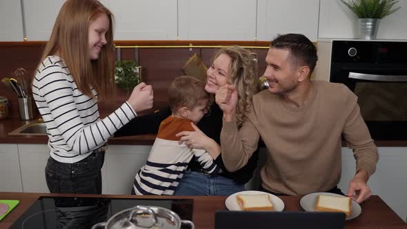 Happy Deaf Family Indoors Hugs of Mom and Kids alt