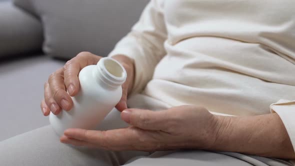 Mature Woman Female Taking Pill at Home, Vitamins for Elderly People Health