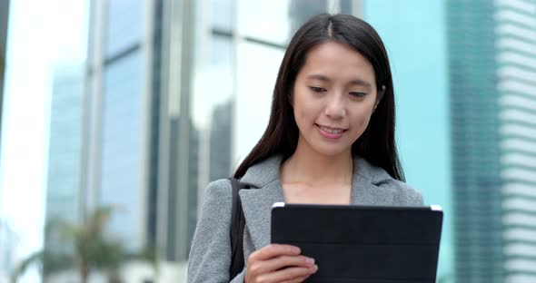Business woman use of tablet computer in Hong Kong alt