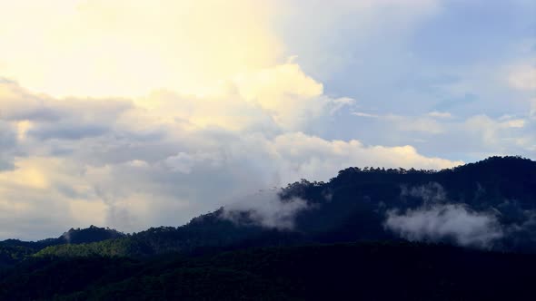 Timelapse Clouds Swirl Over Blue Mountains Snowy Peak in the Distance alt