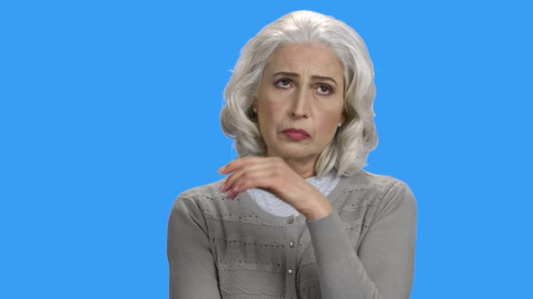 Worried Woman with a Headache Touching Her Head alt