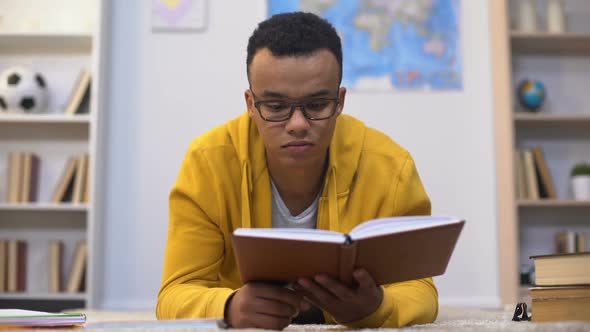 Overworked African-American Student Preparing for Test Feeling Lack of Energy alt