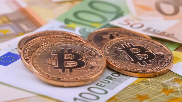 Euro Banknotes and Bitcoin Coins