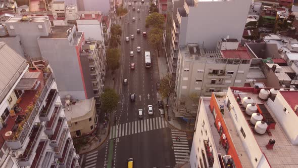 Aerial view showing traffic on large avenue in capital of argentina during sunset time - buenos aire alt