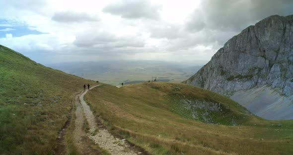 Ultrawide View on the Footpath on Savin Kuk Mountain Top on a Cloudy Windy Day in Durmitor National alt