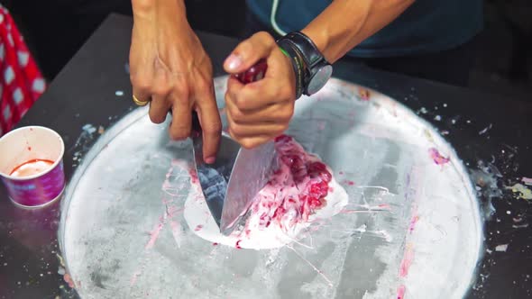 Slow motion shot of fried ice cream, street food prepared from fresh fruit and milk alt