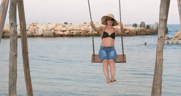 Woman Swings on Beach alt