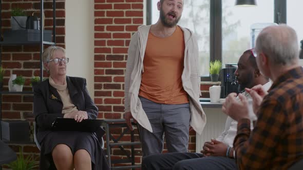 Alcohol Addict with Desperate Behavior Having Breakdown at Aa Therapy Meeting alt