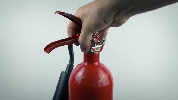 Fire Extinguisher Is Picked Up Moving Shot alt
