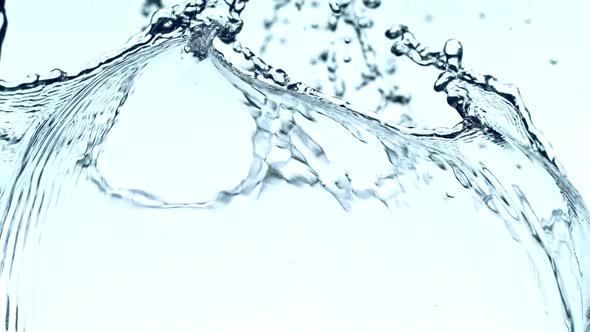 Super Slow Motion Shot of Water Splash at 1000Fps on White Background alt