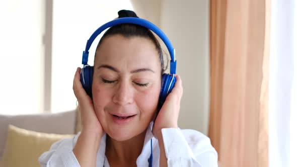 Woman Listening To Music With Headphones And Having Fun