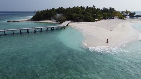 Aerial View of a Tropical Paradise Island Bay Covered in Limestone Trees with Crystal Clear Beach