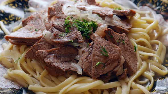 Etnic Kazakh Food  Beshbarmak Meat with Noodles