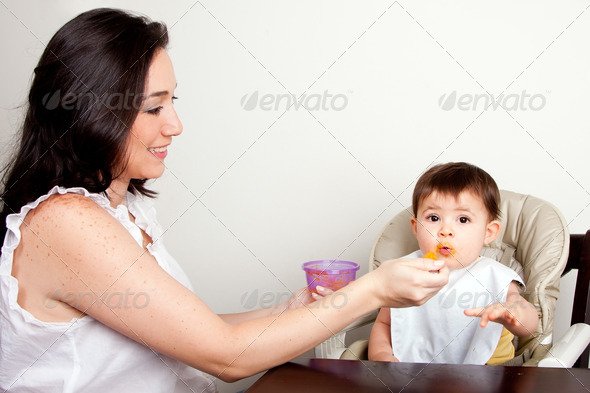 Funny baby messy eater - Stock Photo - Images