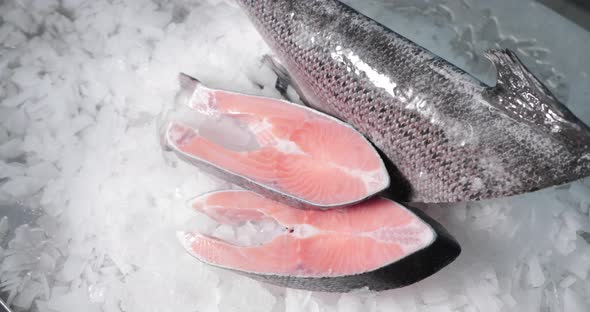 Close-Up Shot Of Sliced Salmon On Crushed Ice - high angle alt