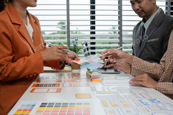 Creative Team Collaborating on UX UI Design Concepts with Color ...