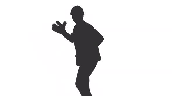 Silhouette Of Funny Worker In Helmet And Big Gloves Dancing And Having Fun