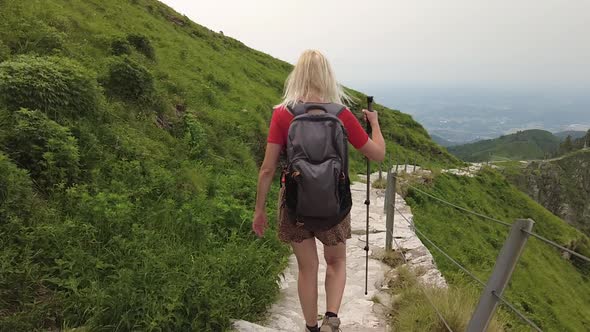 Tourist Girl Trekking on Monte Generoso alt
