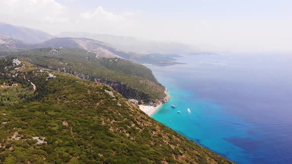 Aerial Drone View of Gjipe Beach and Canyon Dhermi Albania Hidden Paraside with Boats Tourists alt