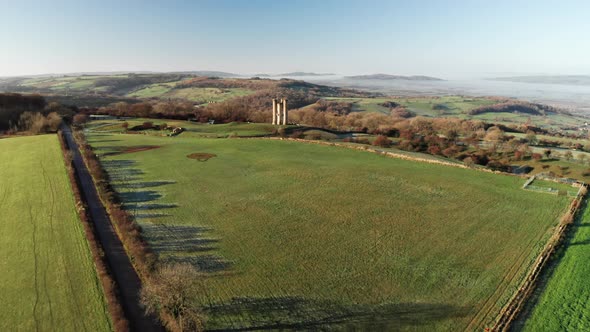 Aerial drone video of Broadway Tower, a famous old building landmark in The Cotswolds Hills, iconic  alt