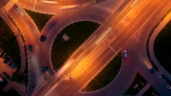 Top View of Road Traffic on Circle Road Intersection at Night