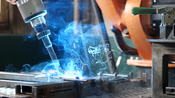 Automatic Welding Machine Arm in an Action alt