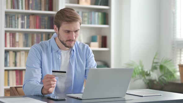 Man Making Successful Online Payment on Laptop alt