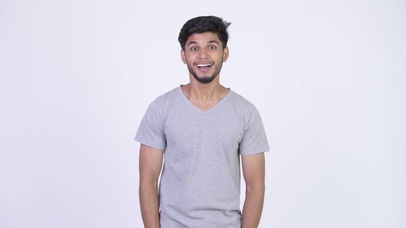 Young Happy Bearded Indian Man Getting Good News alt