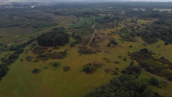Aerial birds eye view shot flying over the beautiful Sutton Park in England alt