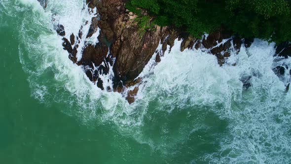 Aerial view Drone camera top down of seashore rocks in ocean Beautiful sea surface Amazing sea waves alt