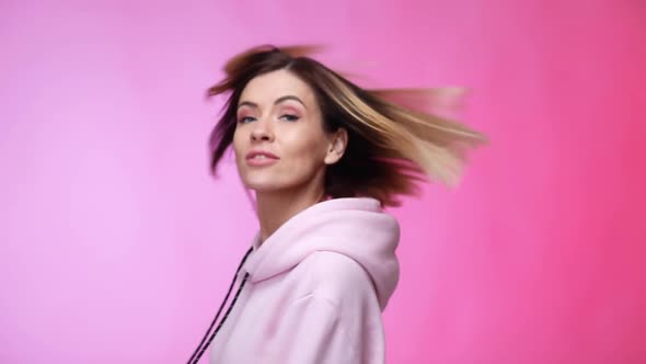Young Caucasian Woman on Pink Color Background