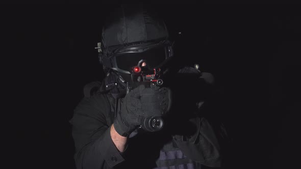 The Soldier Holds a Laser Sight on The Target alt